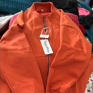 SuperPrity Orange Zip-Up Jacket. NWT. Size M.